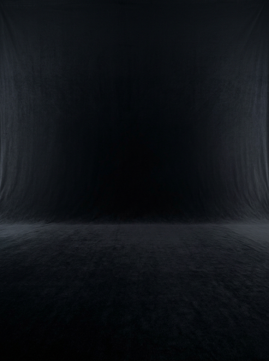 Zero-reflection deep black velvet backdrop for isolating rim-lit portraits and fine jewellery
